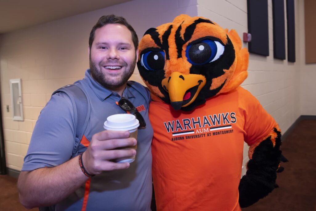 student with AUM Warhawks mascot